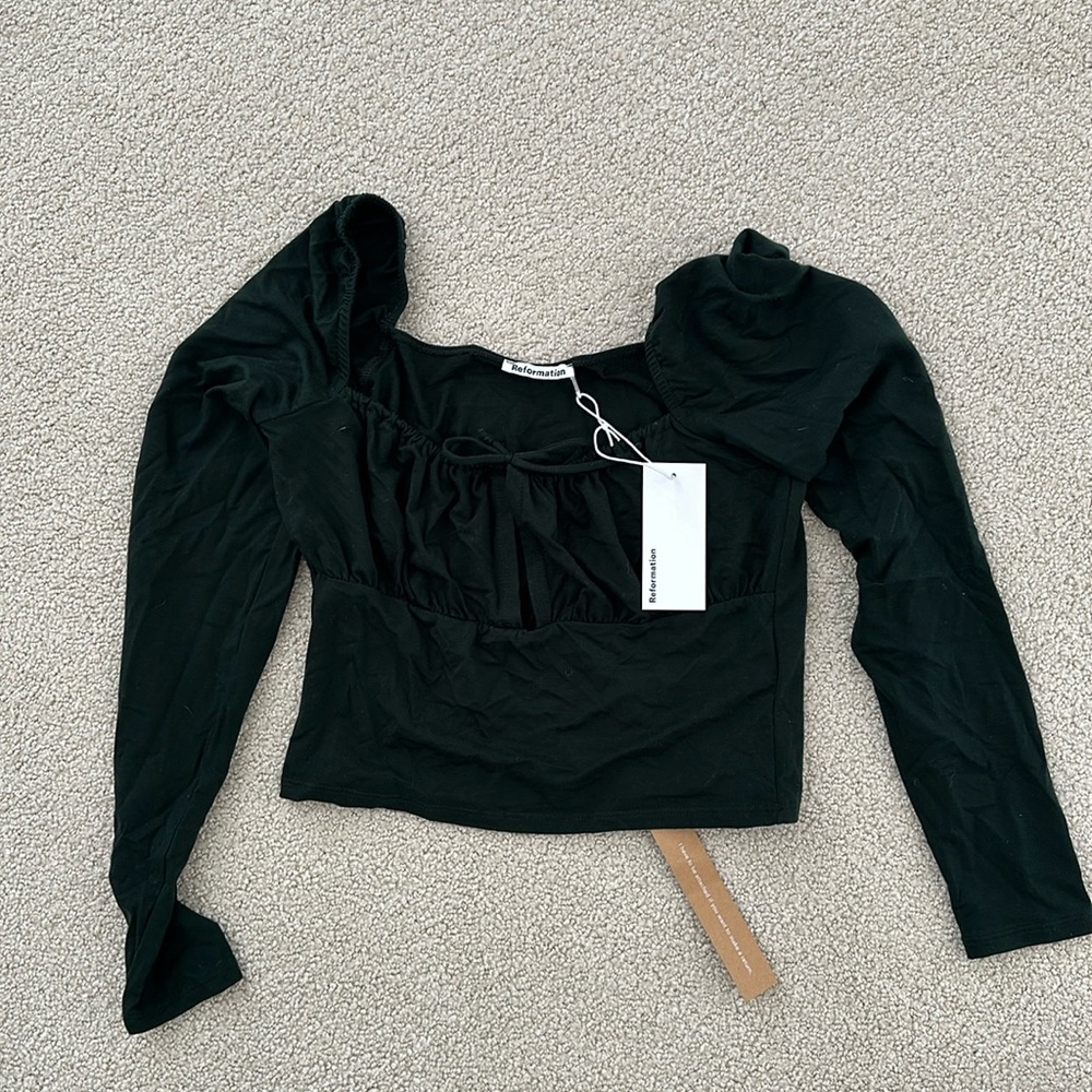 Reformation Samuel top in forest. Size medium.